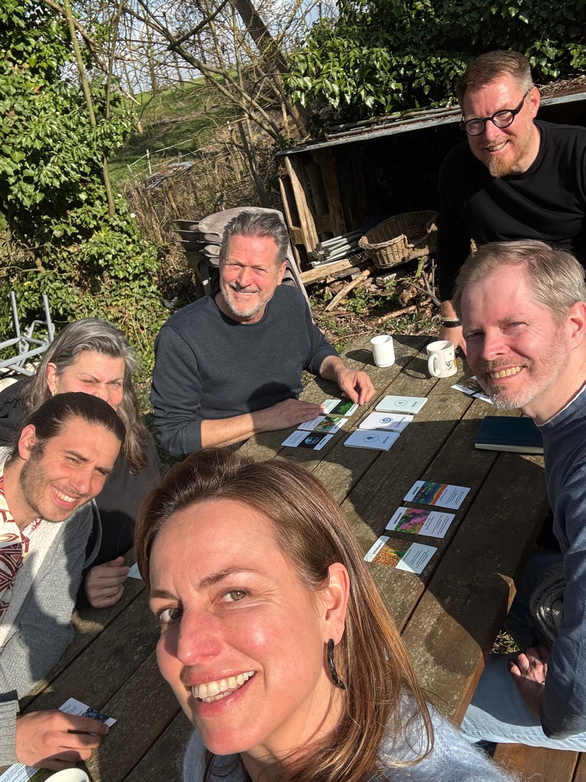 Group working together outdoors at the picnic table